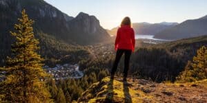 woman hiking on her own having an adventure after recovering from a divorce